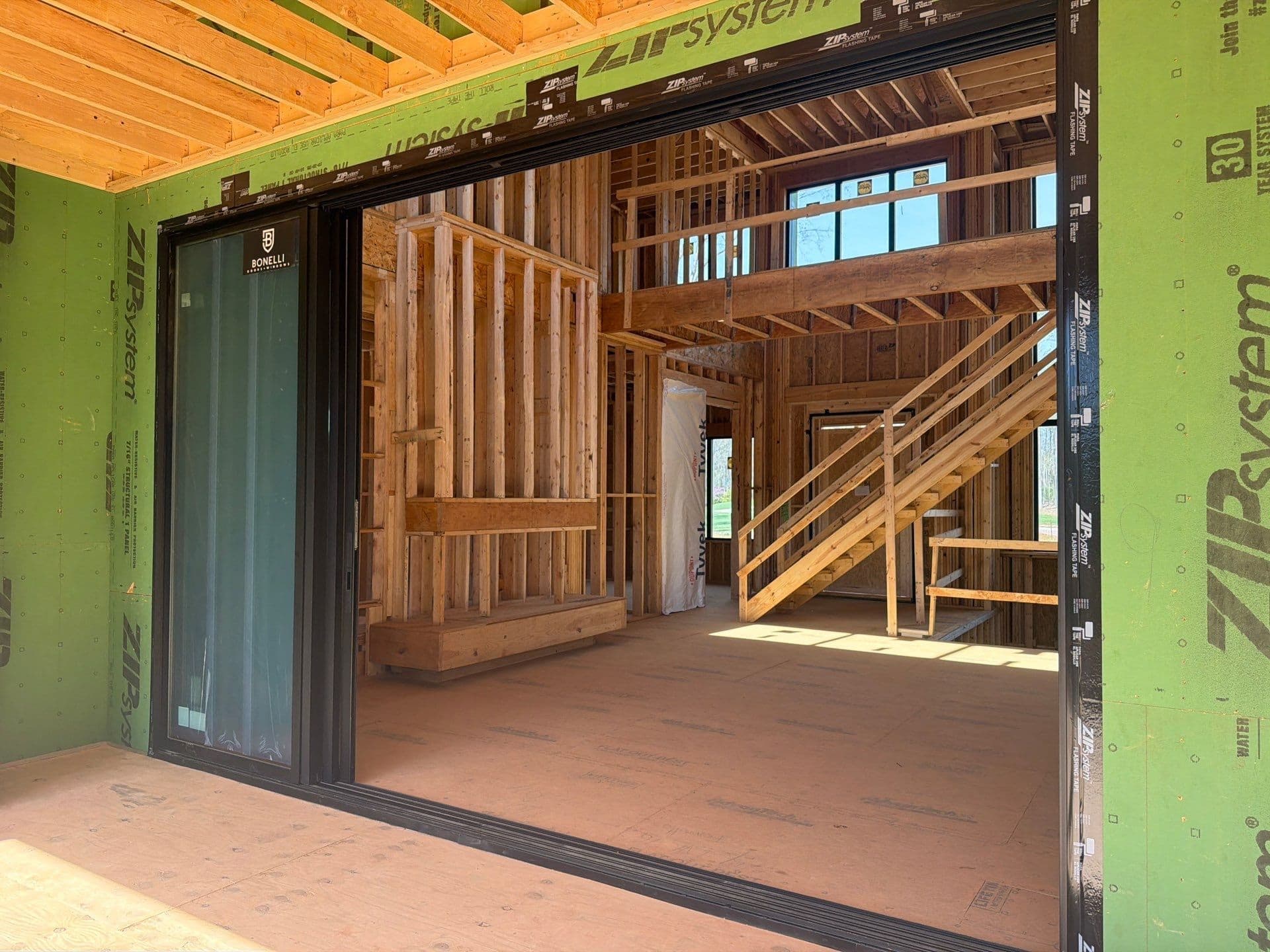 1107 Vision Path large sliding-door opening connecting the interior living space to the covered outdoor area, Concord NC