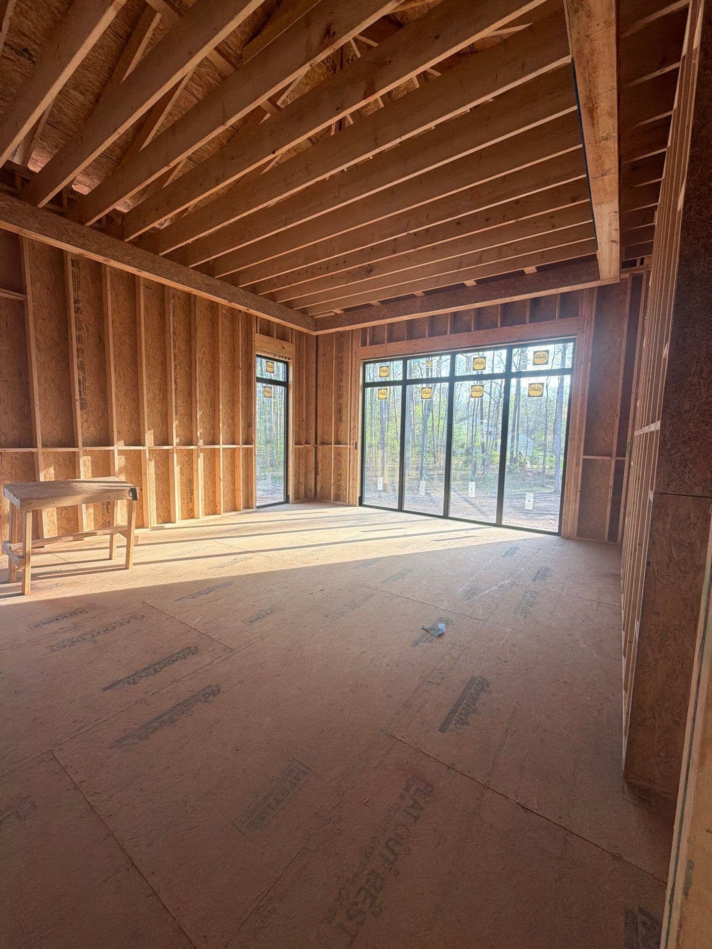 1107 Vision Path framing with large windows — afternoon sun flooding the future living space, Concord NC
