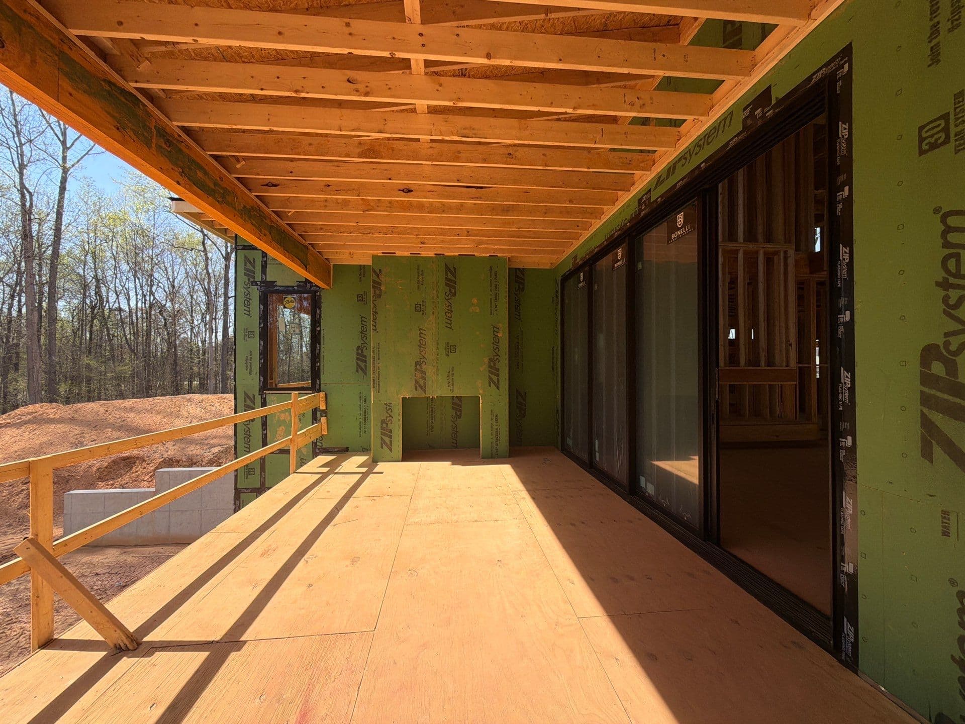 1107 Vision Path covered porch framing with ZIP sheathing — outdoor living space, Concord NC