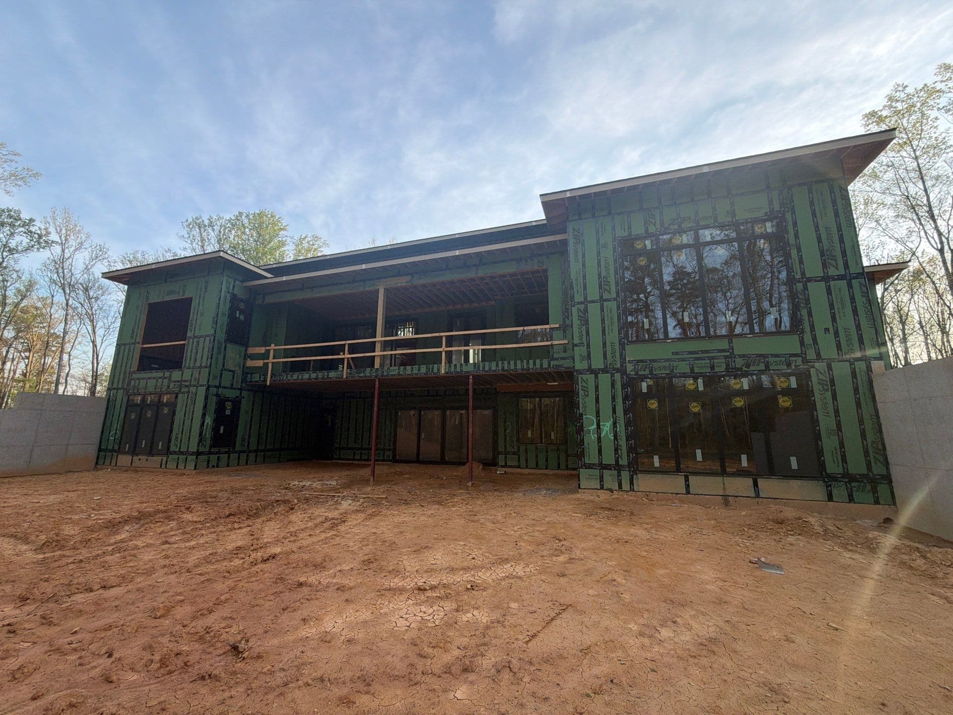 1107 Vision Path rear elevation and stacked outdoor living spaces during construction, Concord NC