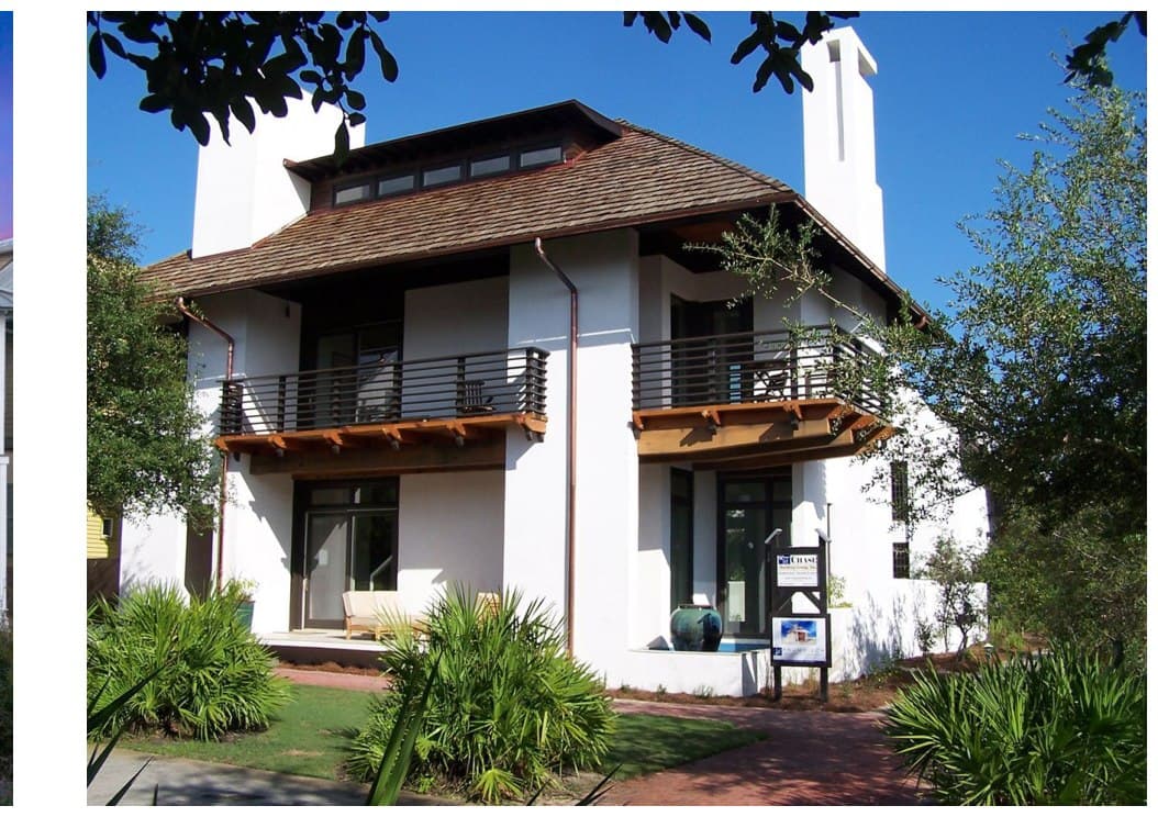 Inspiration imagery for The Preserve — a white home with a cedar hip roof and a covered second-floor balcony